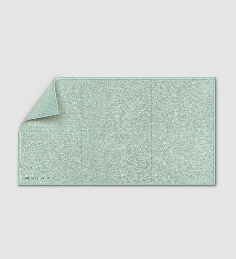 Simplehuman's clean cloth in sage green on a white background.