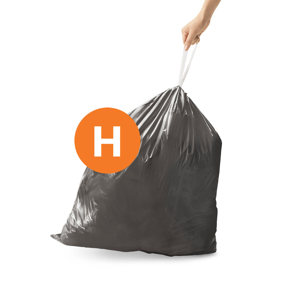 Simplehuman Code H Custom Fit Odorsorb Liner, dark gray, secured by drawstring closure and lifted.