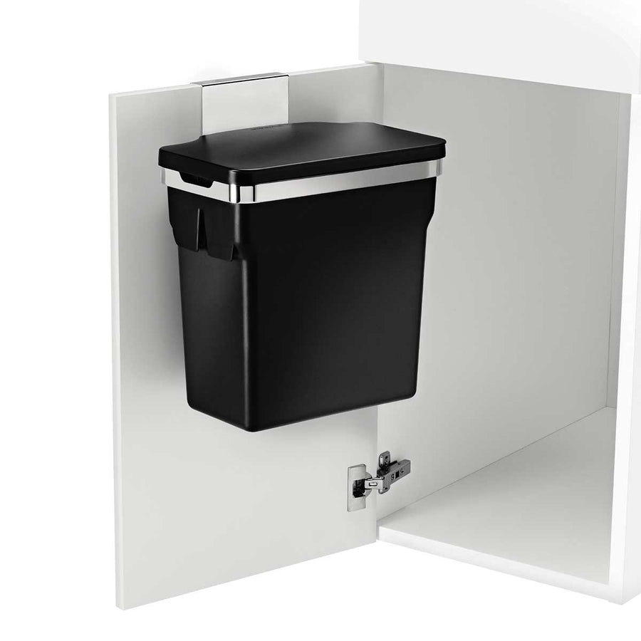 Angled view, Simplehuman 10L Door Mounted Can in Matte Black, mounted inside cabinet for concealed waste storage.
