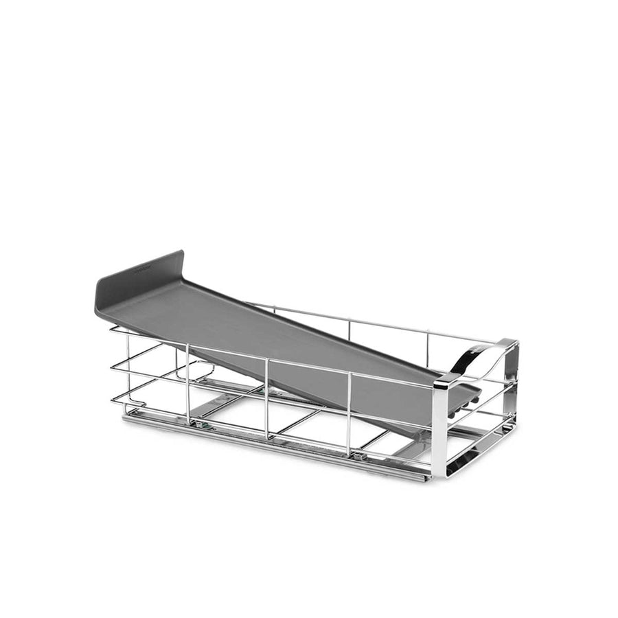 Angled view of Simplehuman 9 Inch Pull-Out Cabinet Organizer, Polished Steel, showing the smooth glide track and sloped tray.