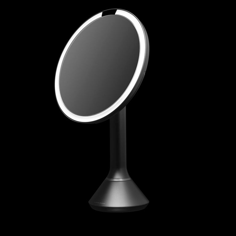 Simplehuman's Sensor Mirror Round on a black background. 