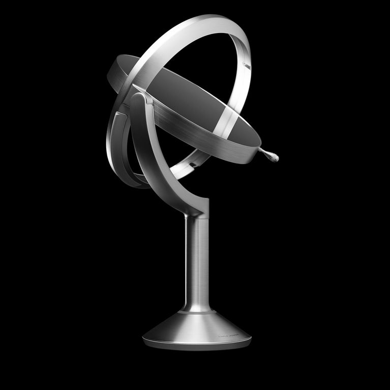 Simplehuman's Sensor Mirror Trio on a black background. 
