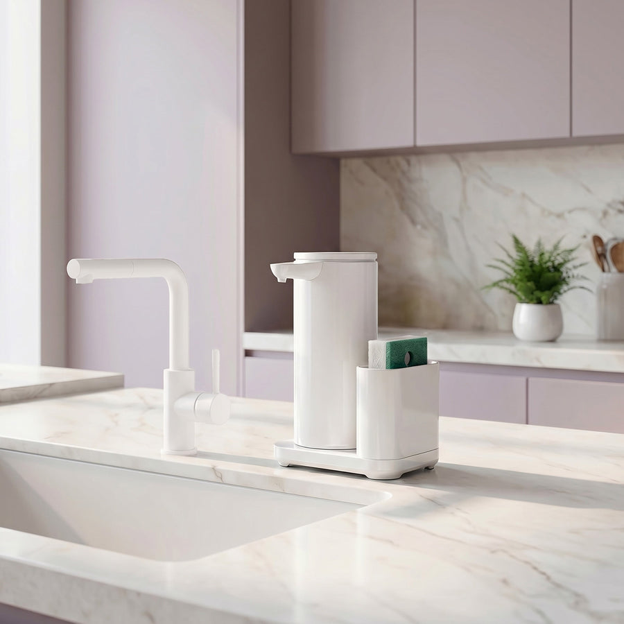 Simplehuman's 9 oz. Liquid Sensor Pump with Caddy in White in a modern kitchen setting with lilac cabinets, white marble countertop and sink appliances.