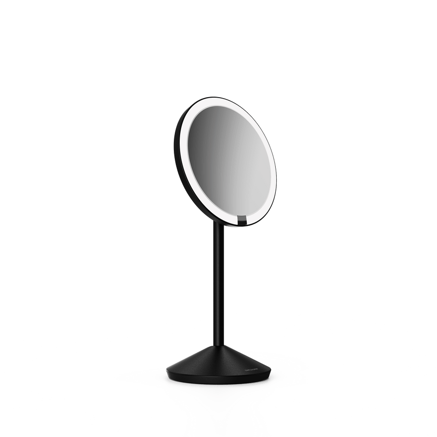 Simplehuman's Sensor Mirror Fold in Matte Black, angled view.